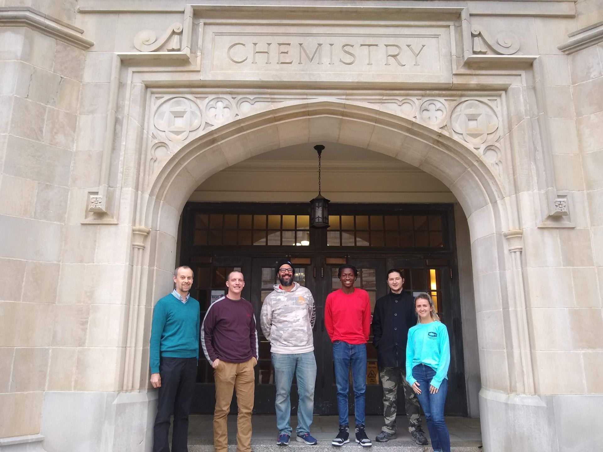 The Edwards Group poses for a group photo in front of the Chemistry Building